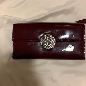 Coach burgundy wallet used.